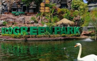 Eco Green Park Batu dengan latar taman hijau dan kolam air